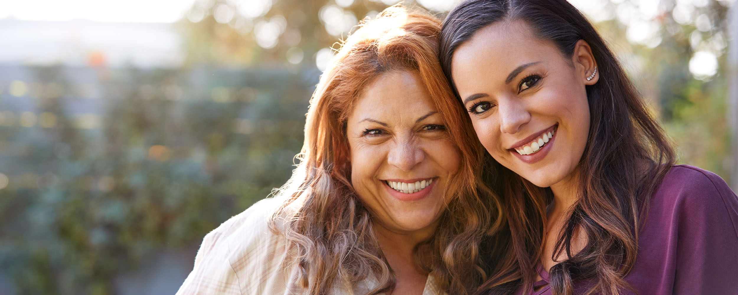 An adult mother and daughter.